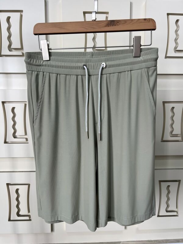 Wysokiej jakości męskie fitness szorty biegowe Wydzielne materiały szybkiego suszenia Długość kolana Letnie plecy kieszonkowe kieszonkowe prosty design