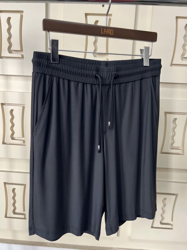 Wysokiej jakości męskie fitness szorty biegowe Wydzielne materiały szybkiego suszenia Długość kolana Letnie plecy kieszonkowe kieszonkowe prosty design